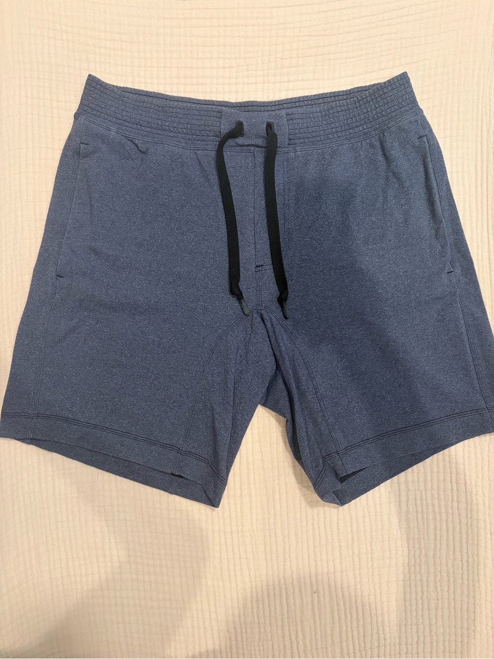 lululemon Men's City Sweat Short 9" in a soft heathered blue/charcoal color.
